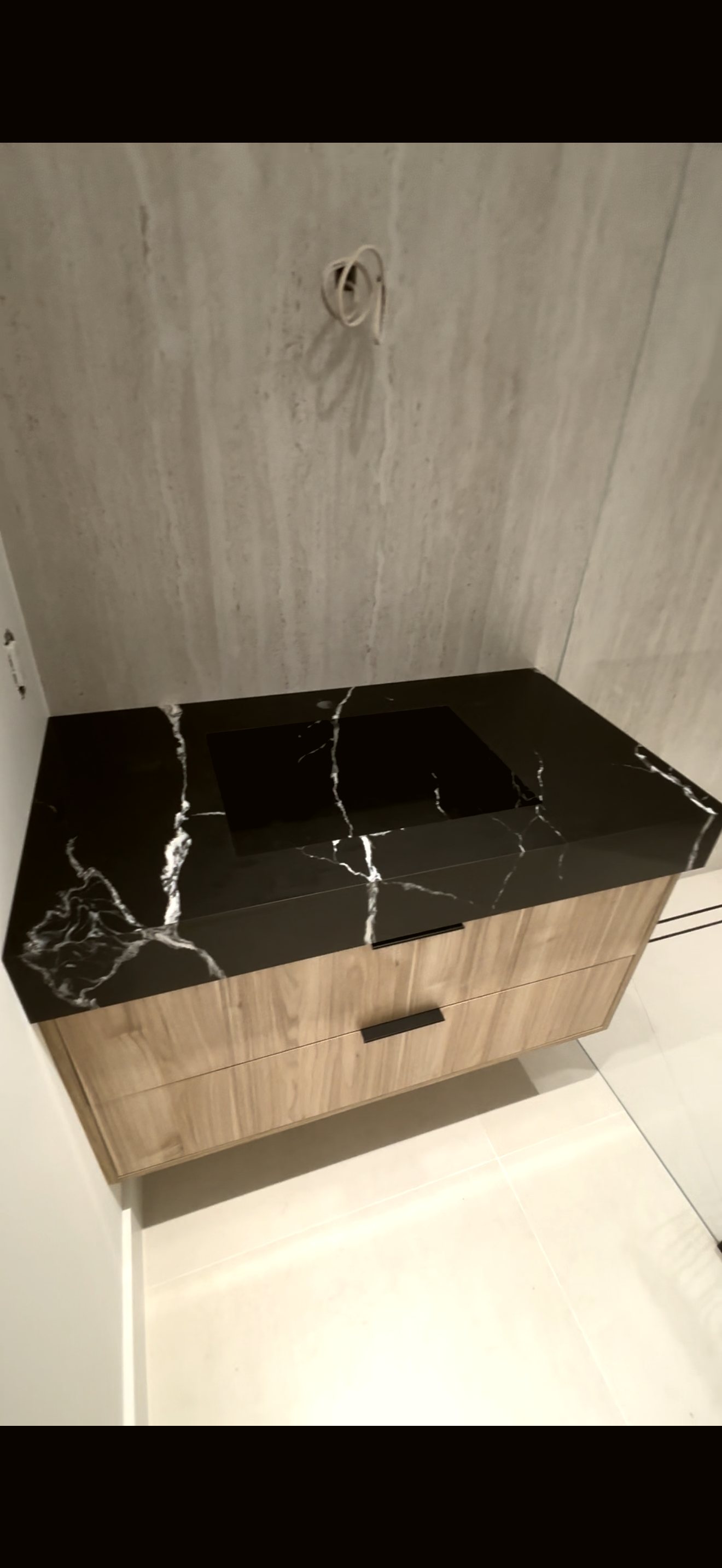 Black marble integrated sink design — real project