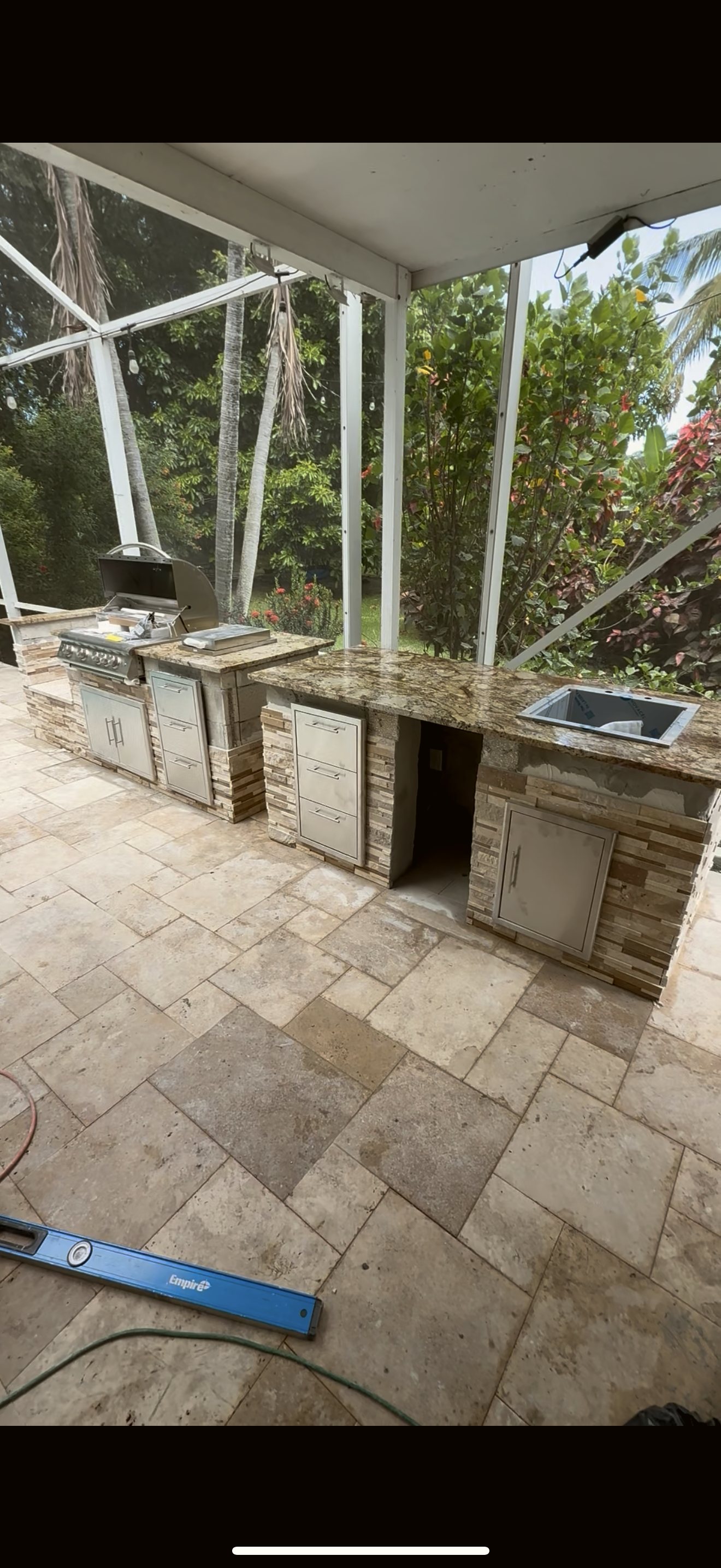 Custom stone outdoor kitchen — real Miami project