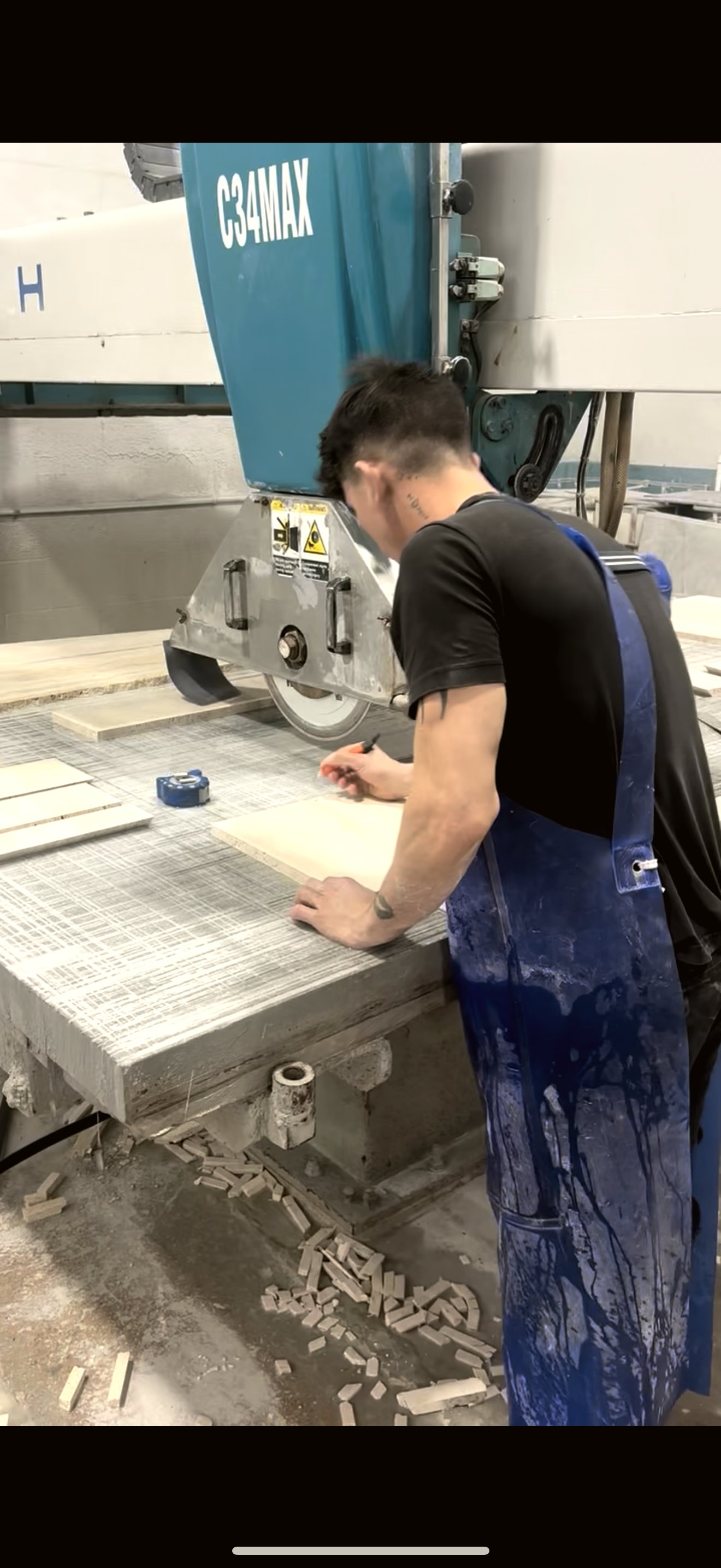 Cutting the raw stone slab in our Hialeah shop