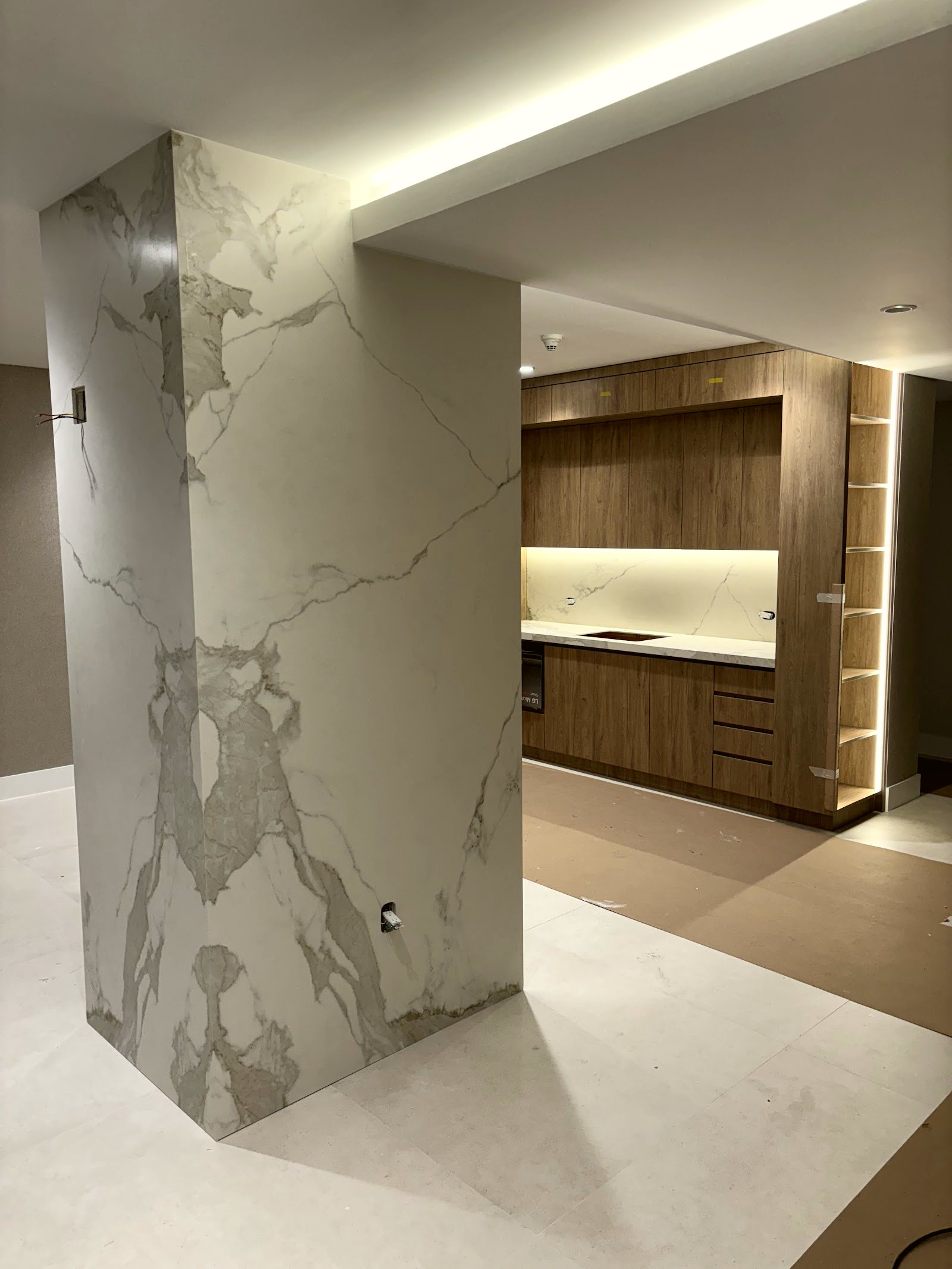 Marble feature wall and custom millwork — real project